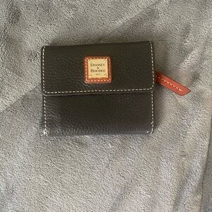The Dooney & Bourke Pebble Grain Small Flap Wallet with Red Accents 1975 Edition